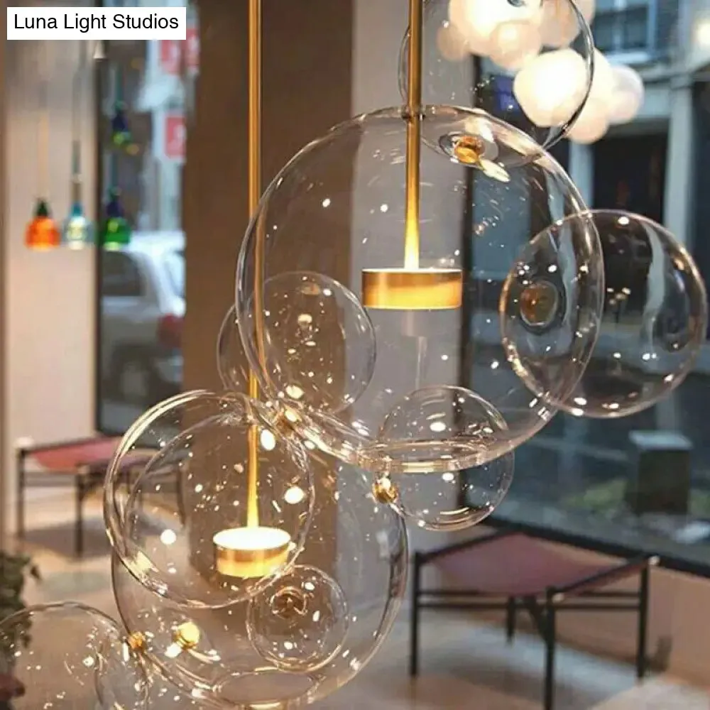 Minimal Brass Bubble Pendant Light with 5 Clear Glass Heads