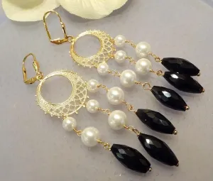 Statement white mother of pearl and black onyx gemstone earrings.